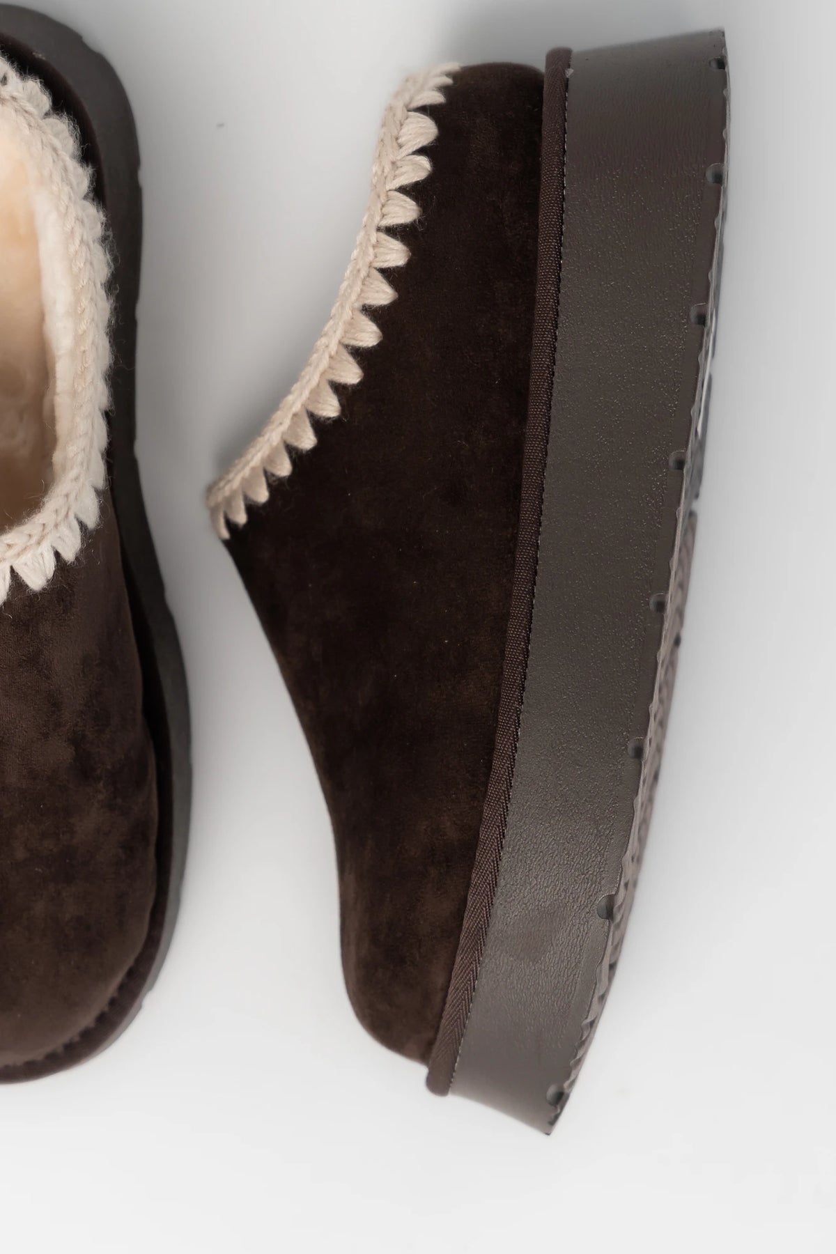 Pamela Platform Cozy Mule Slippers in Chocolate with faux suede, plush lining, whipstitch trim, and platform sole.