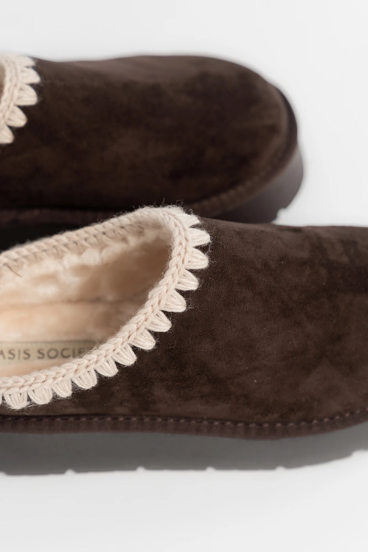 Pamela Platform Cozy Mule Slippers in Chocolate with faux suede, plush lining, whipstitch trim, and platform sole.