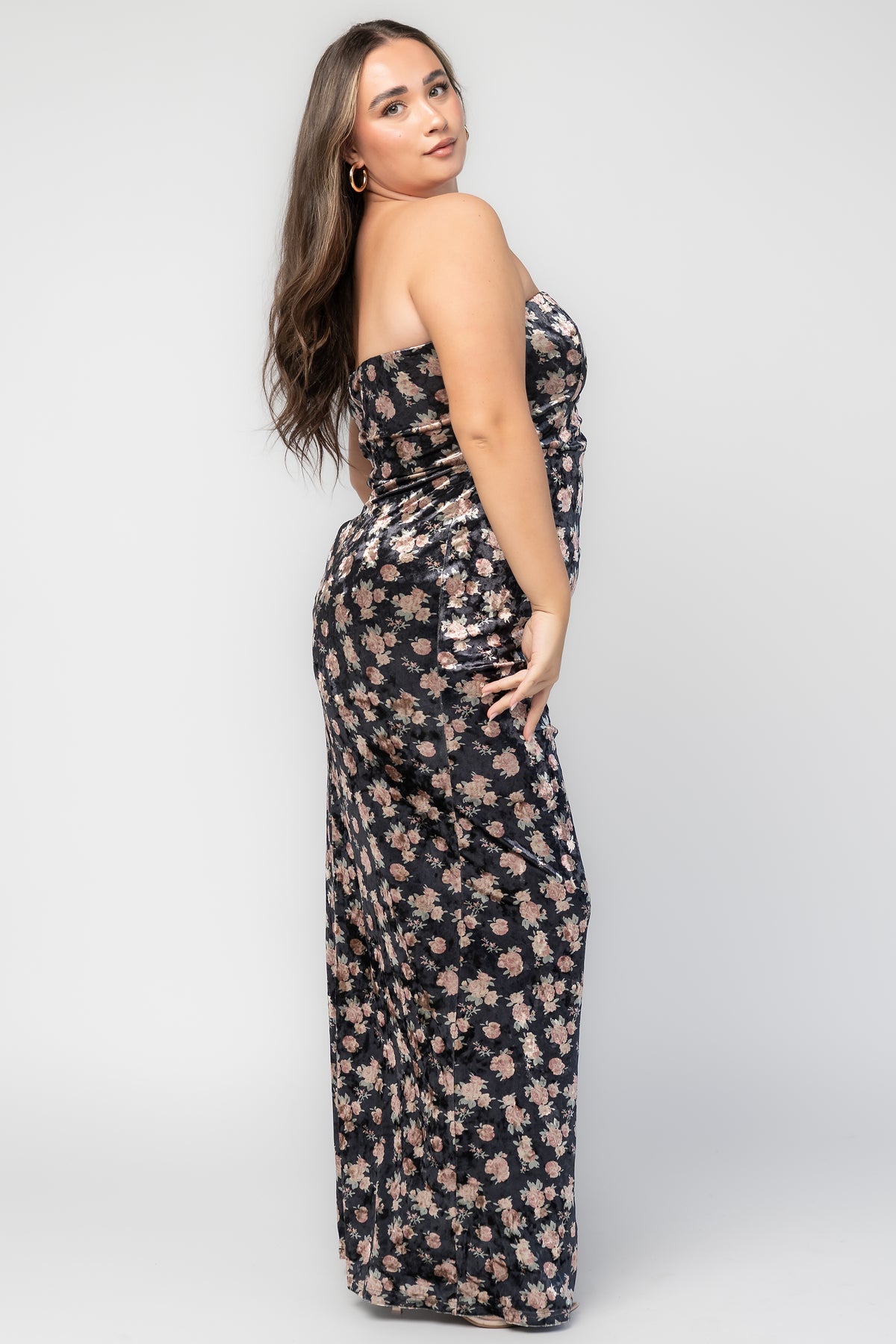 Philippa Velvet Maxi Dress in Black Floral with strapless neckline, floral velvet fabric, side ruching, and thigh-high slit.