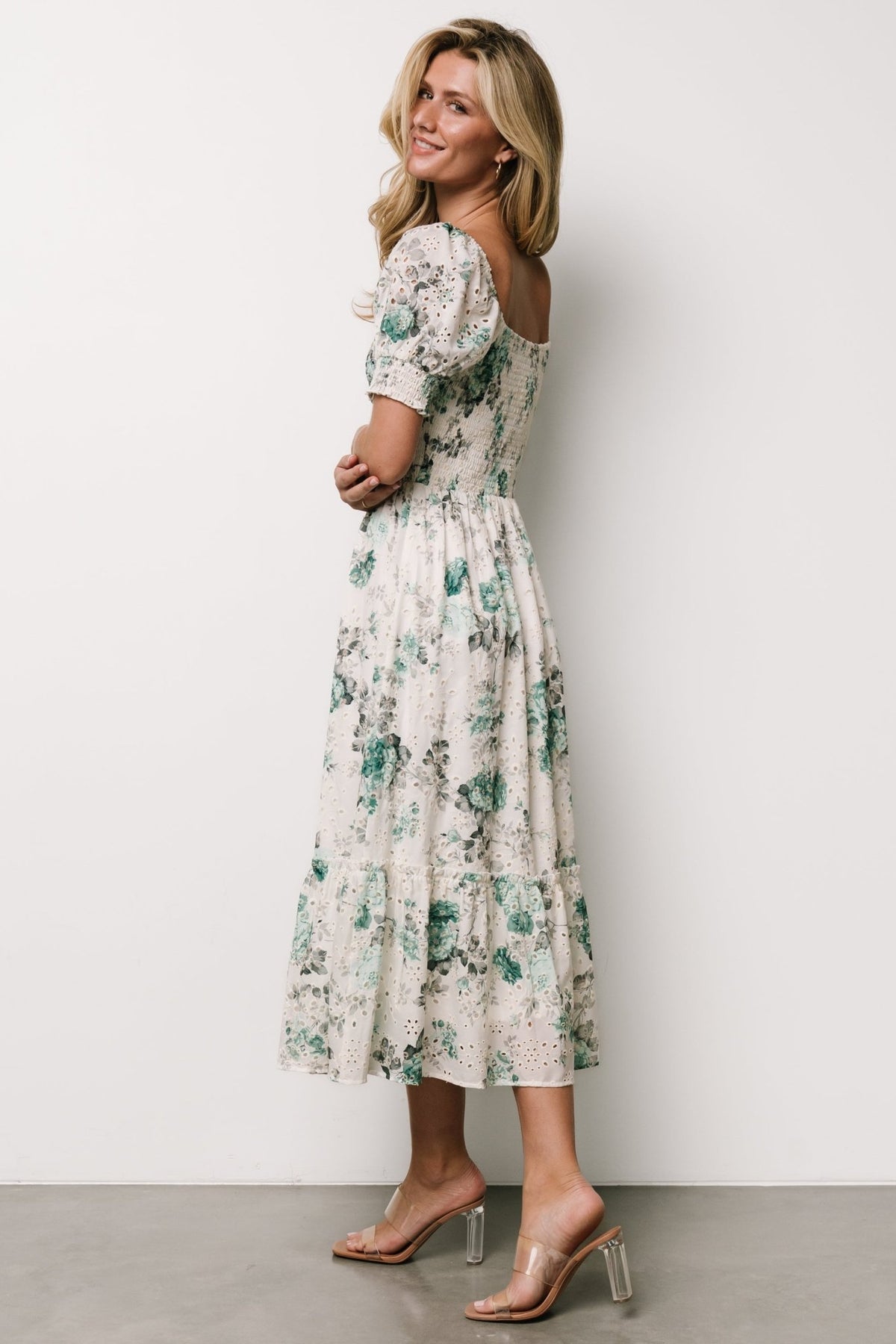 Back view of Piper Eyelet Midi Dress showing smocked back bodice, ruffle-bordered tier and mid-calf skirt length.