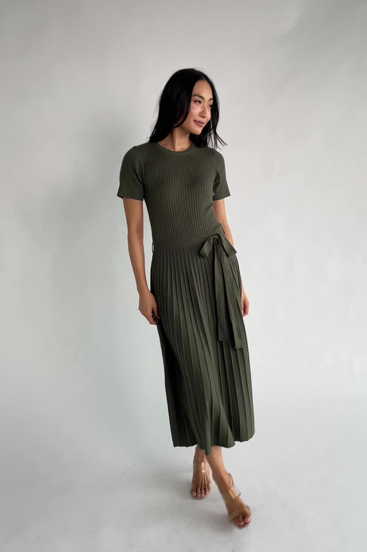 Jessamine Midi Dress with ribbed sweater knit, crew neckline, short sleeves, self-tie waist belt, and pleated skirt.