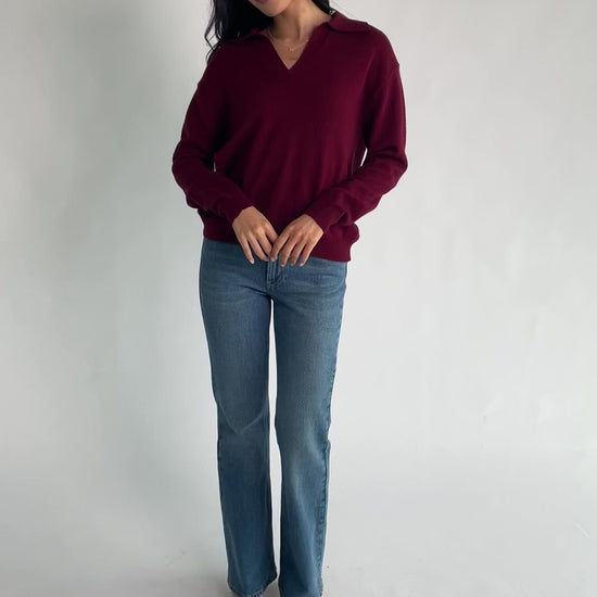 Bodhi Sweater with open rugby-style collar, dropped shoulders, long sleeves, and ribbed cuffs and hem.