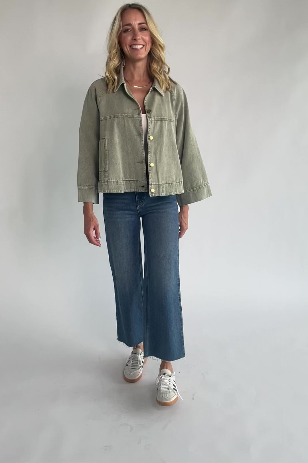 Dusty Olive Cropped Cotton Jacket with collared neckline, button front, raglan sleeves, adjustable cuffs, and side pockets.