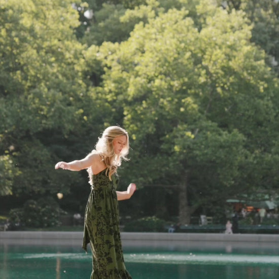 Rowan Tank Maxi Dress in Deep Olive with floral print, adjustable straps, smocked back, sash tie, and tiered skirt.