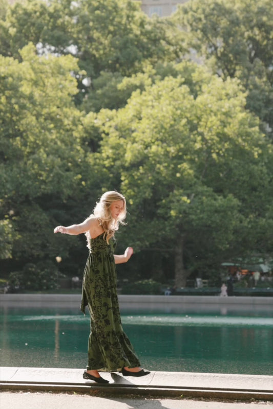 Rowan Tank Maxi Dress in Deep Olive with floral print, adjustable straps, smocked back, sash tie, and tiered skirt.