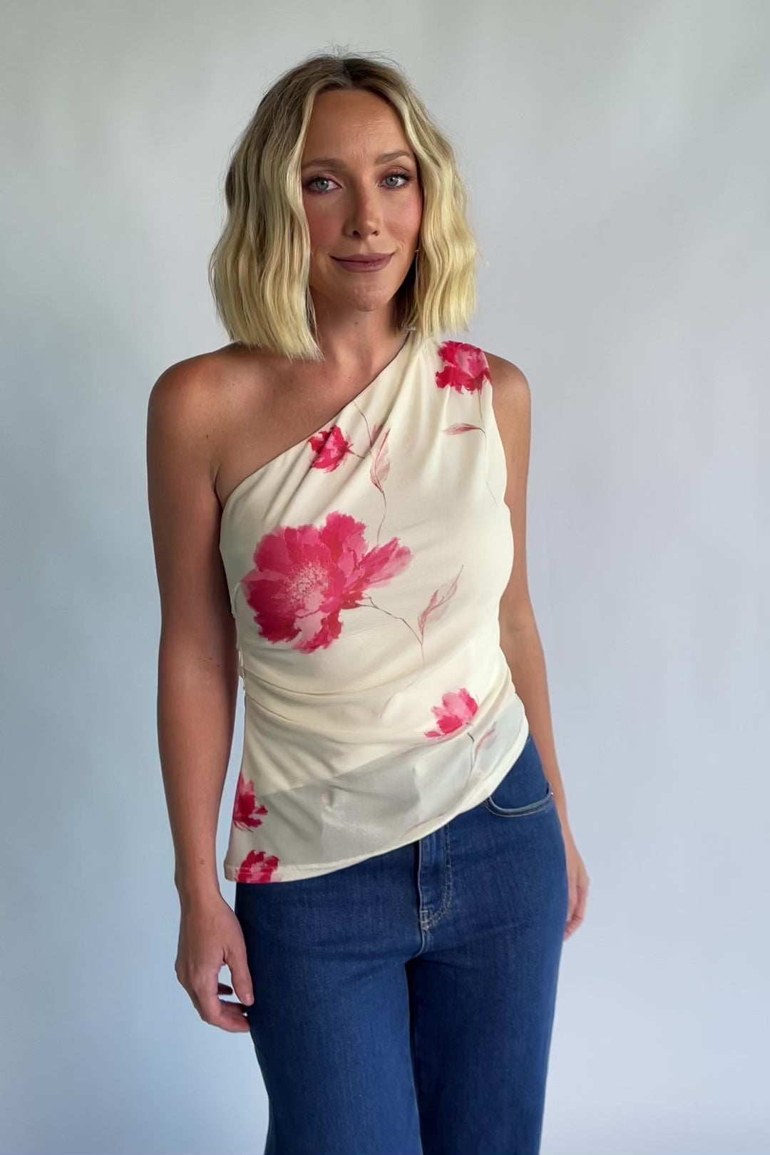 Cleo Mesh Top in Cream Floral with one-shoulder neckline, ruched bodice, and fitted silhouette.