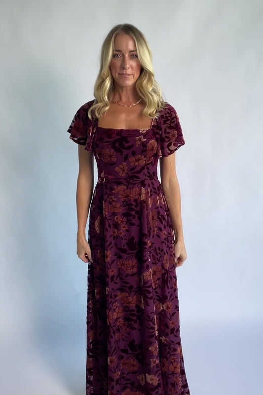 Clio Maxi Dress in Mulberry + Gold Floral with square neckline, flutter sleeves, and empire waist.