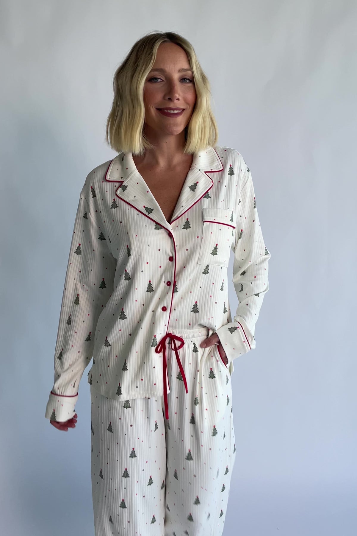 Holiday Cozy Rib Knit Pajamas in Ivory + Evergreen with an evergreen tree print, button-front top, and contrast red piping.