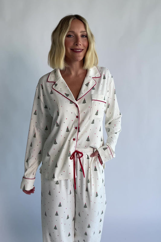 Holiday Cozy Rib Knit Pajamas in Ivory + Evergreen with an evergreen tree print, button-front top, and contrast red piping.