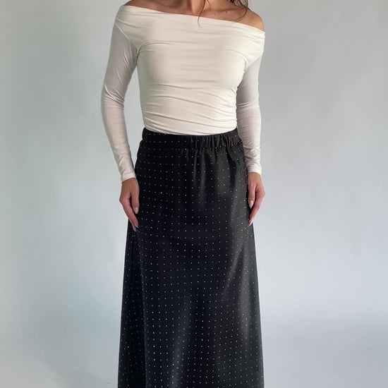 Zaylee Skirt in Black with rhinestone embellishments, elastic waistband, and flowing maxi silhouette.
