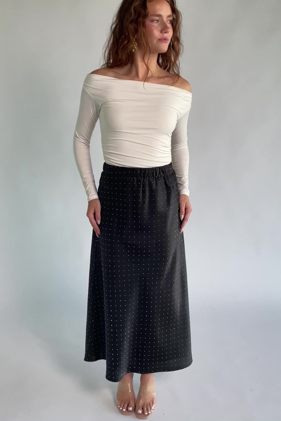 Zaylee Skirt in Black with rhinestone embellishments, elastic waistband, and flowing maxi silhouette.