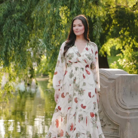 Cream Floral Chiffon Maxi Dress with rust and green florals, surplice neckline, long sleeves, waist ties, and tiered skirt.