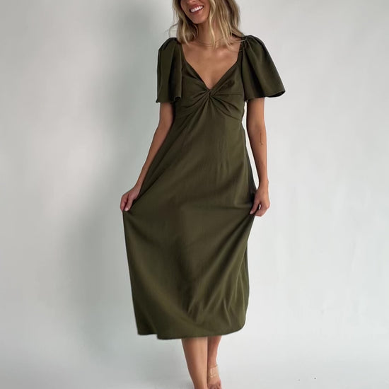 Indie Back Tie Dress in Olive with sweetheart neckline, butterfly sleeves, open tie-back, and side pockets.