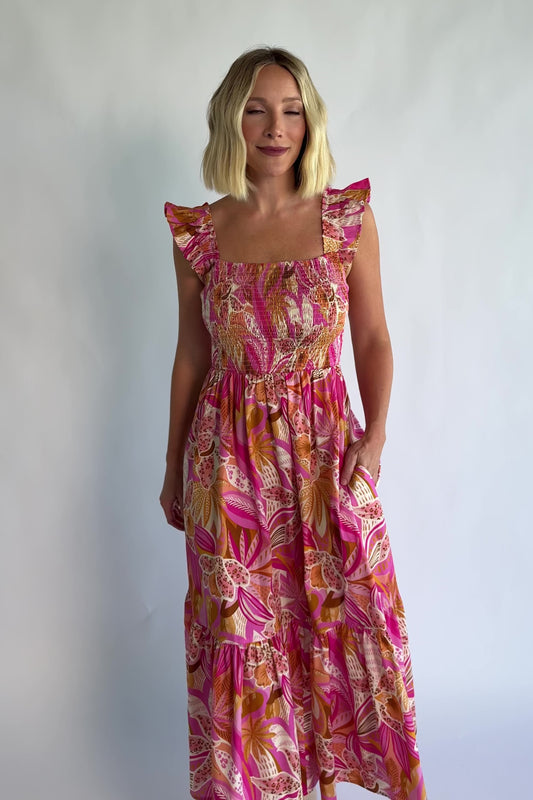 Carla Smocked Dress in Pink Multi with a smocked bodice, square neckline, ruffle straps, and a flowy midi skirt.
