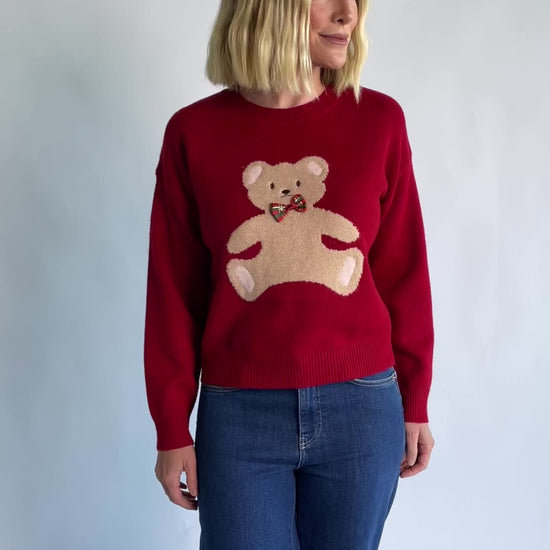Jaxton Sweater in Red with a round neckline, ribbed trim, and a teddy bear graphic with a bow tie.