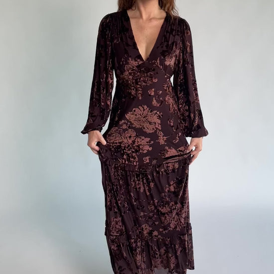Liana Velvet Embossed Ruffle-Tier Maxi Dress in Brown with V-neck, long sleeves, elastic waist, and tiered skirt.