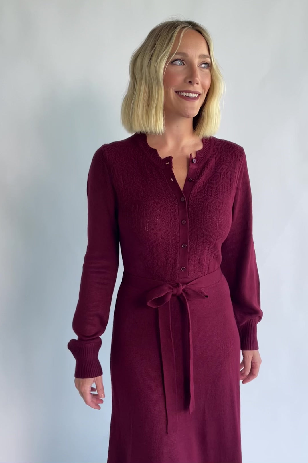 Camilla Sweater Dress in Wine with a knit button-down bodice, removable waist belt, and a flowing lined skirt.