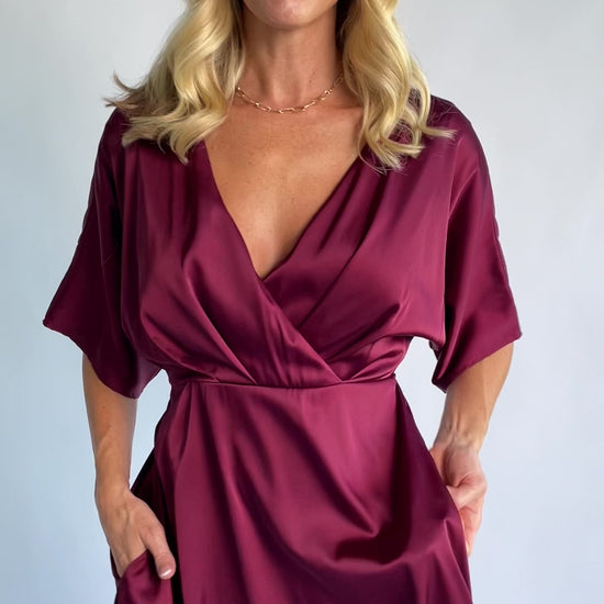 Veda Midi Dress in Burgundy with V-neckline, adjustable back tie, and hidden side pockets.