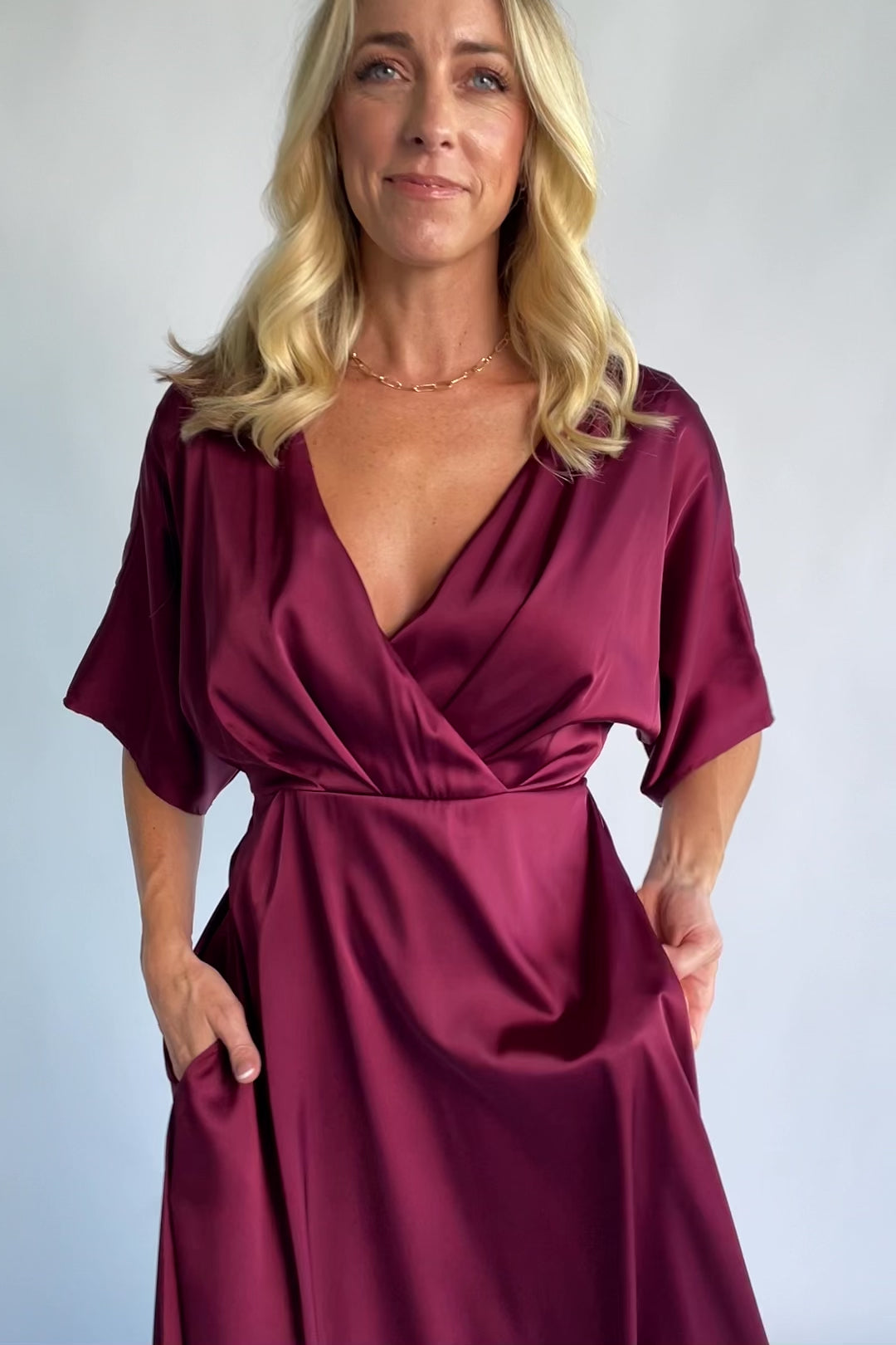 Veda Midi Dress in Burgundy with V-neckline, adjustable back tie, and hidden side pockets.