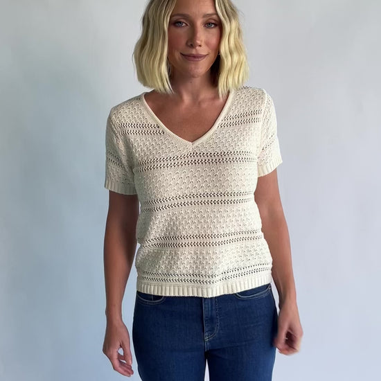 Albon Open Knit Top in Cream with V-neckline, open knit texture, and ribbed trim.