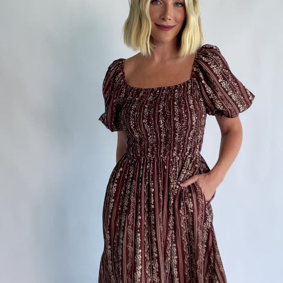 Keira Midi Dress in Mahogany Print with a square neckline, smocked bodice, and short puff sleeves.