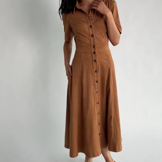 Fifth Avenue Button Up Dress in Camel with faux suede finish, collared neckline, button front, and A-line midi skirt.