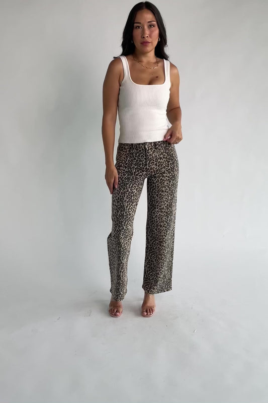 Leopard Print Wide Leg Pants with high-rise waist, button and zip closure, belt loops, and front and back pockets.