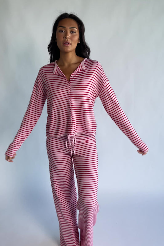 Charlene Cozy Stripe Lounge Set in Pink + Red with striped pattern and coordinating top and pants.