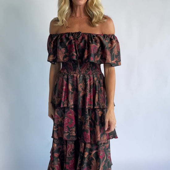Isabelle Off Shoulder Maxi Dress in Black Multi Print with off-shoulder neckline, smocked waist, and tiered maxi skirt.