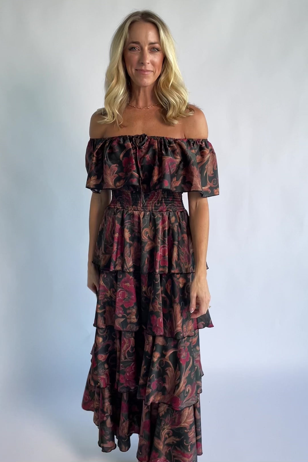 Isabelle Off Shoulder Maxi Dress in Black Multi Print with off-shoulder neckline, smocked waist, and tiered maxi skirt.
