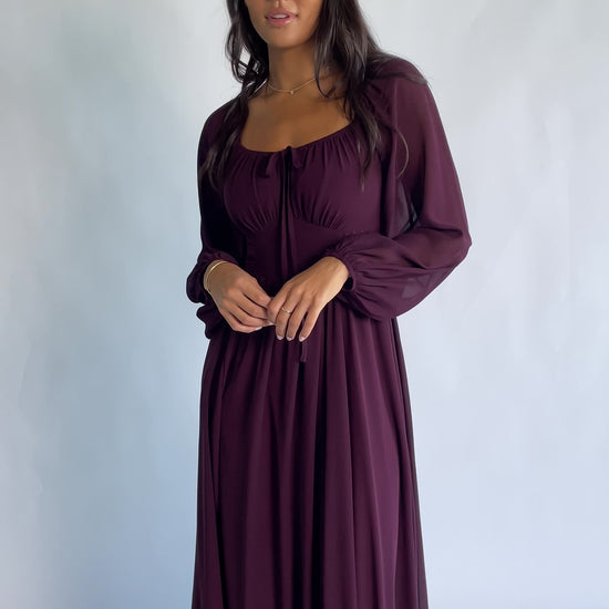 Maddalena Maxi Dress in Dark Plum with embroidered chevron detailing, a sweetheart neckline, and sheer sleeves.