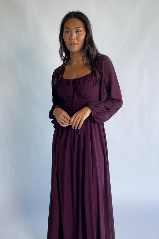 Maddalena Maxi Dress in Dark Plum with embroidered chevron detailing, a sweetheart neckline, and sheer sleeves.