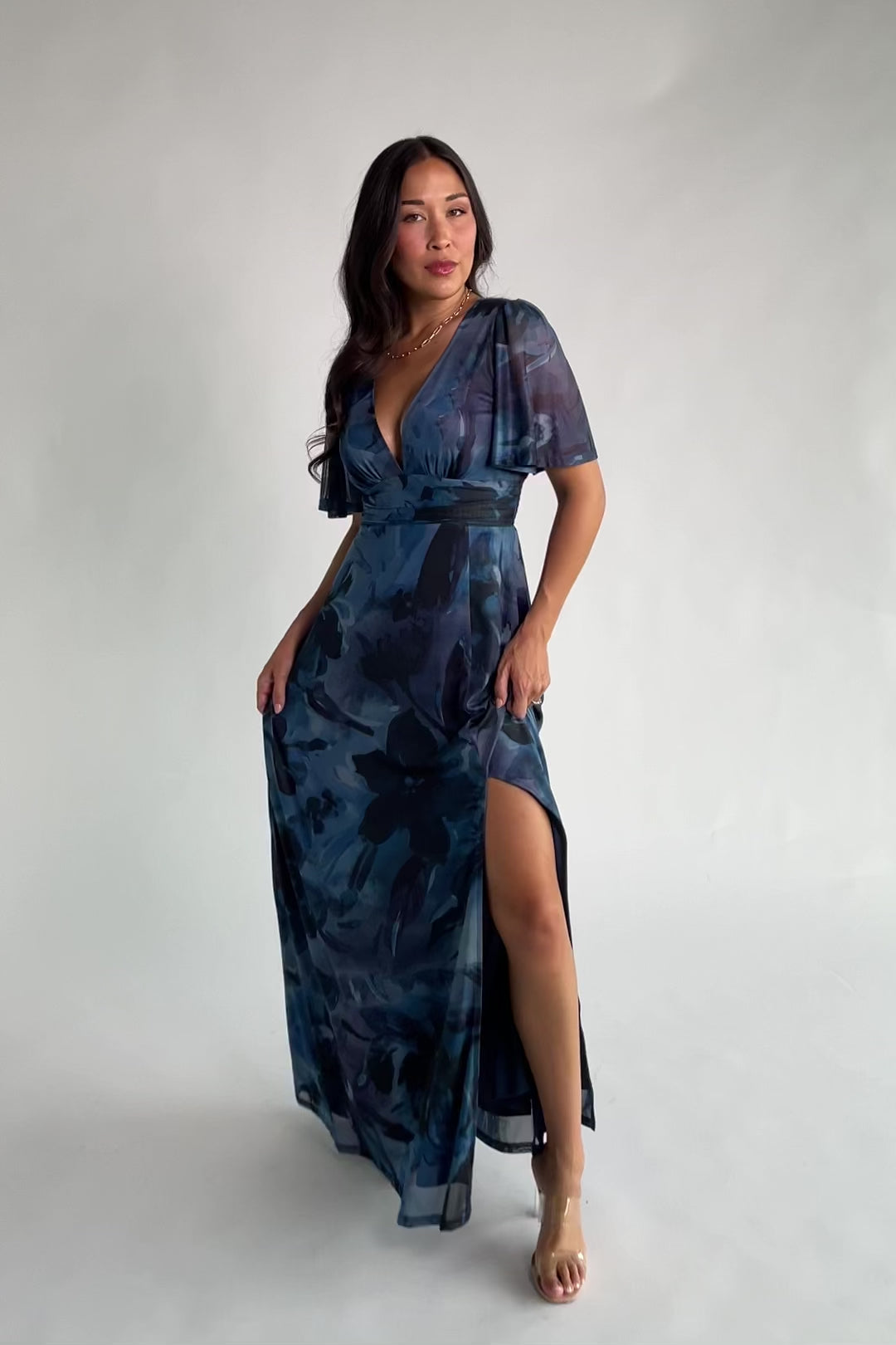 Arianne Mesh Maxi Dress in Midnight Floral with deep V-neck, flutter sleeves, empire waist, floral print, and leg slit.