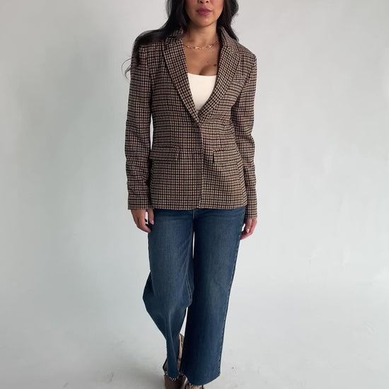 Damien Plaid Blazer in black and camel plaid with tailored waist, two-button front, flap pockets, and long sleeves.