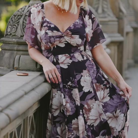Positano Maxi Dress in Dusty Plum Floral with sweetheart neckline, flutter sleeves, smocked back, and tiered skirt.