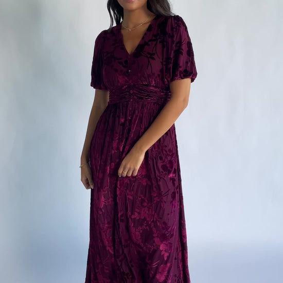 Dahlia Velvet Dress in Mulberry Floral with embossed velvet texture, a V-neckline, faux-button placket, and puff sleeves.