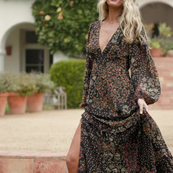 Bowman Deep V Tiered Maxi Dress in Black Multi with deep V-neck, long sleeves, ruffle-tiered skirt, and leg slit.