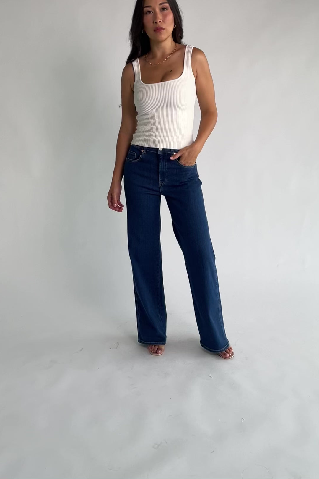 Vesper Mid Rise Wide Leg Jeans in Dark Wash with relaxed wide legs, mid-rise waist, button and zipper closure.