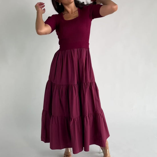 Astra Tiered Dress in Berry with ribbed knit bodice, scoop neckline, short sleeves, and tiered cotton skirt.