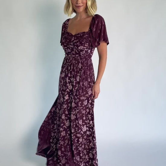 Veloura Maxi Dress in Mulberry Floral with sweetheart neckline, flutter sleeves, ruched bust, smocked back, and velvet florals.