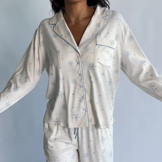 Holiday Cozy Rib Knit Pajamas in Ivory + Ice Blue with a snowflake print, button-front top, and contrast piping.