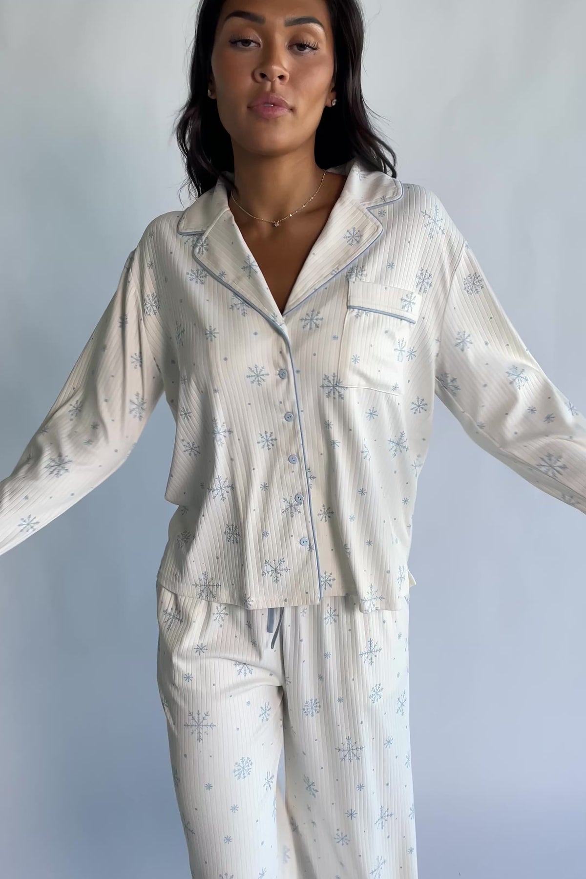 Holiday Cozy Rib Knit Pajamas in Ivory + Ice Blue with a snowflake print, button-front top, and contrast piping.