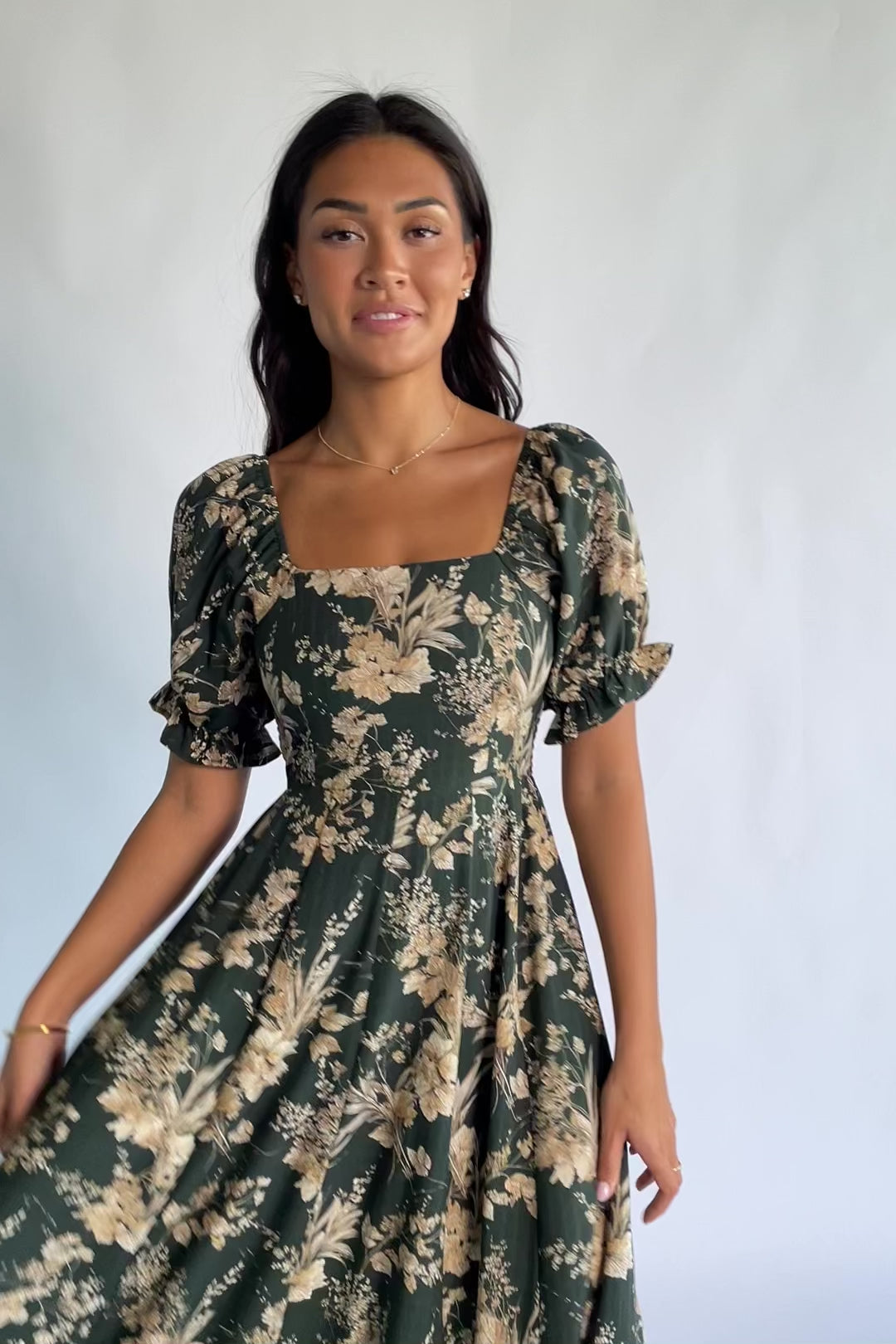 Addison Maxi Dress in Green + Natural with a square neckline, puffed ruffle-cuff sleeves, and a tiered ruffle skirt.