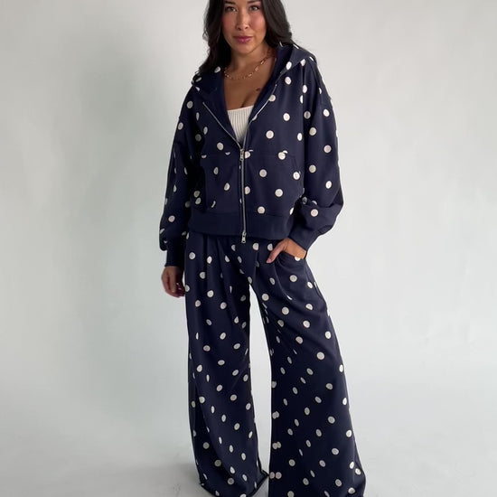 Lydia Wide Leg Sweatpants in Navy Dot with polka dot print, elastic waistband, side pockets, and raw hem.