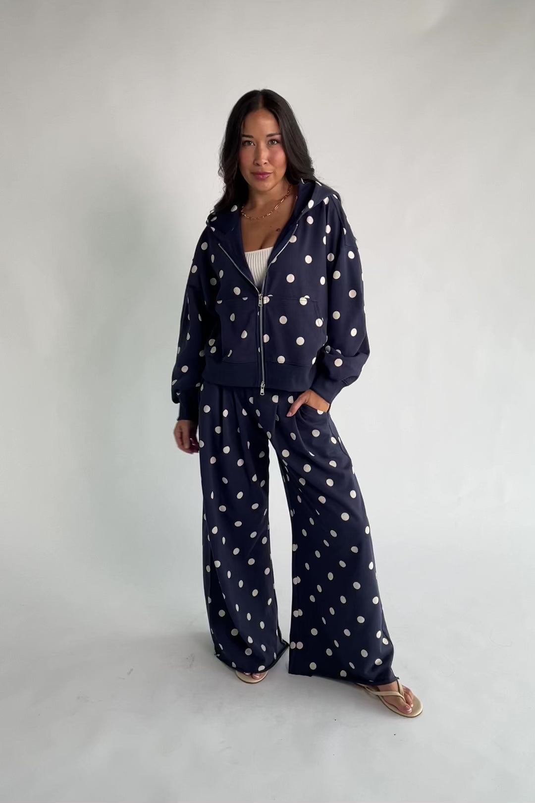 Lydia Wide Leg Sweatpants in Navy Dot with polka dot print, elastic waistband, side pockets, and raw hem.