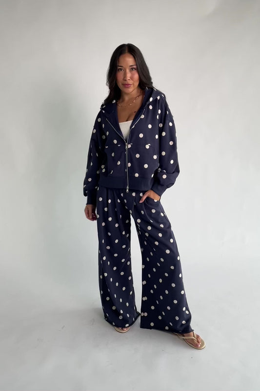 Lydia Wide Leg Sweatpants in Navy Dot with polka dot print, elastic waistband, side pockets, and raw hem.