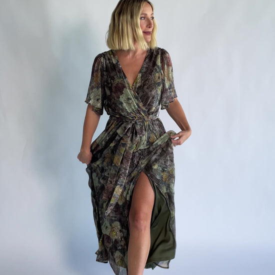 Rachel Maxi Dress in Green Multi with abstract floral details, a faux-wrap neckline, and semi-sheer overlay.