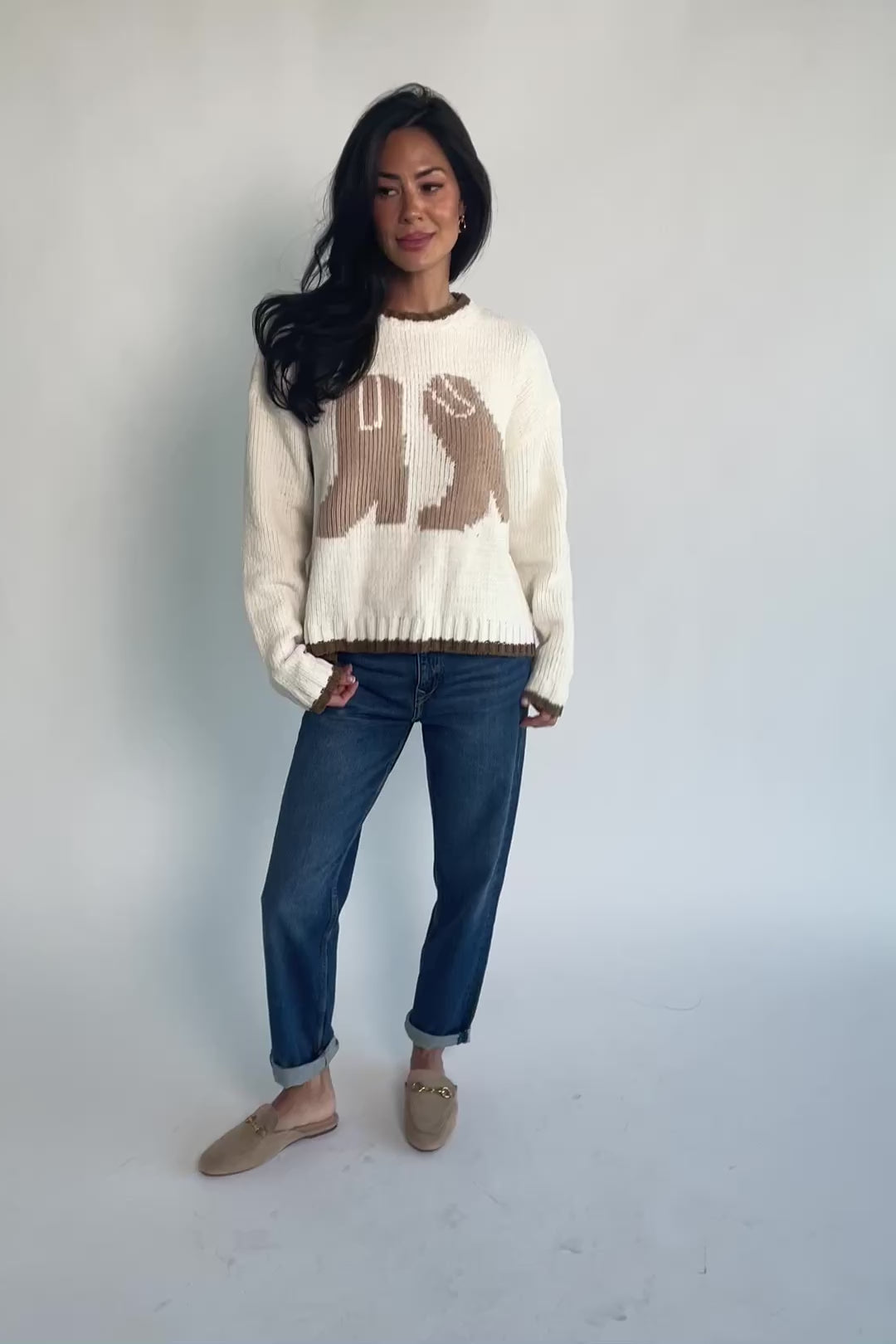 Model wearing the Wild West Knit Sweater in Cream featuring a relaxed fit, Western-inspired yoke detailing, textured knit stitching, long sleeves, and ribbed trim at the neckline, cuffs, and hem.