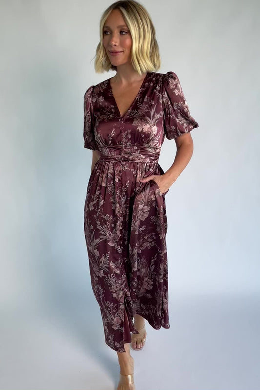 Lilibet Satin Dress in Clove Floral with V-neckline, short sleeves, faux front buttons, gathered waist, and satin finish.