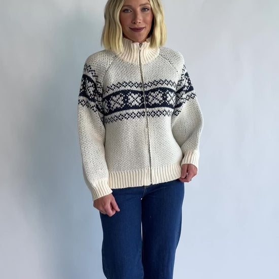 Neve Sweater Jacket in Cream + Navy with a Fair Isle knit pattern, turtleneck, silver zip-front design, and cozy thick knit.